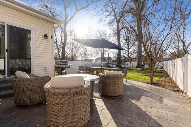 view of patio featuring grilling area and a trampoline