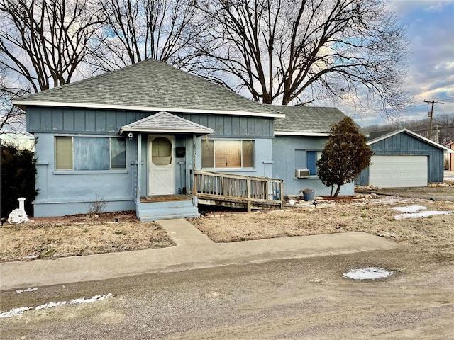 view of front of property featuring an outbuilding and a garage