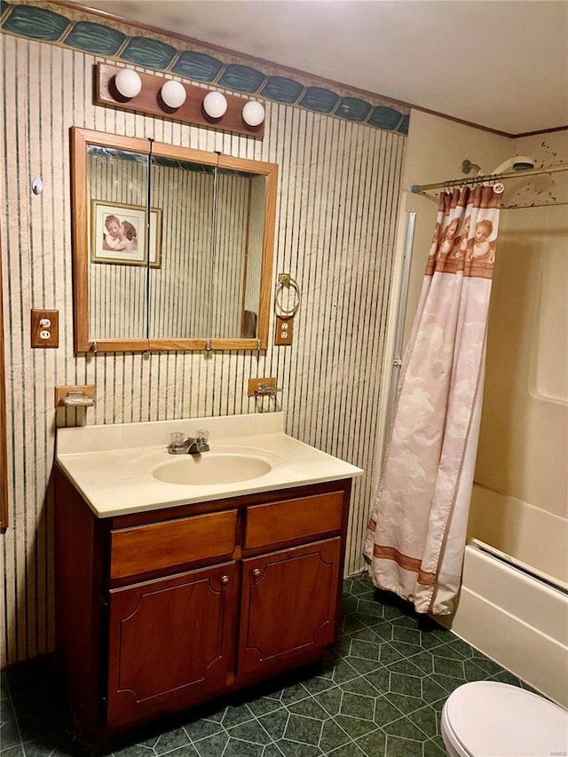 full bathroom featuring vanity, shower / bath combination with curtain, and toilet