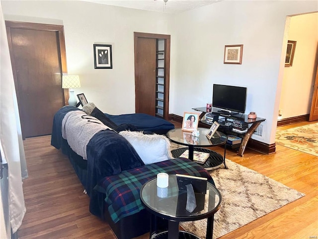 bedroom with hardwood / wood-style floors