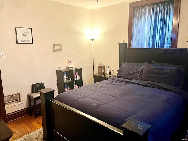 bedroom featuring hardwood / wood-style floors