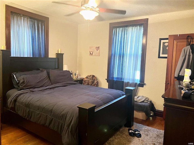 bedroom featuring hardwood / wood-style floors and ceiling fan