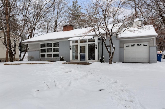 view of front of property with a garage