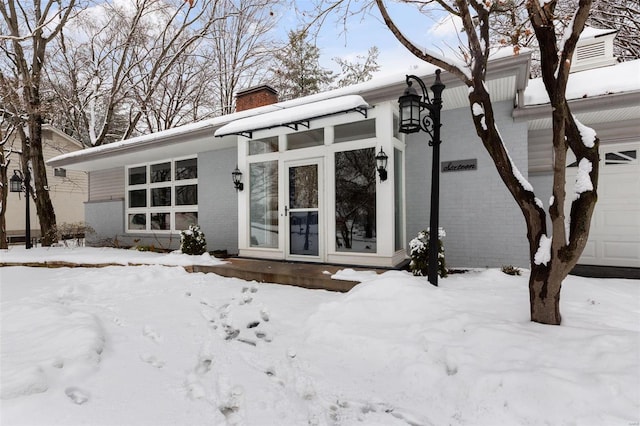 view of snow covered property