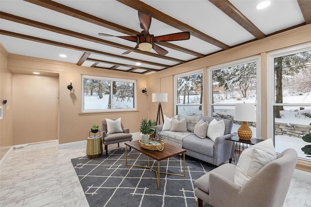 living room featuring ceiling fan and beam ceiling