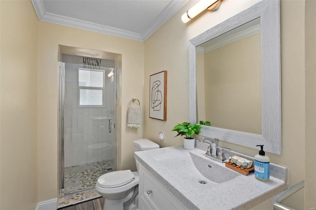 bathroom with wood-type flooring, toilet, crown molding, vanity, and an enclosed shower