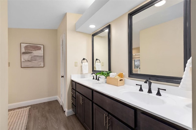 bathroom featuring vanity and hardwood / wood-style floors