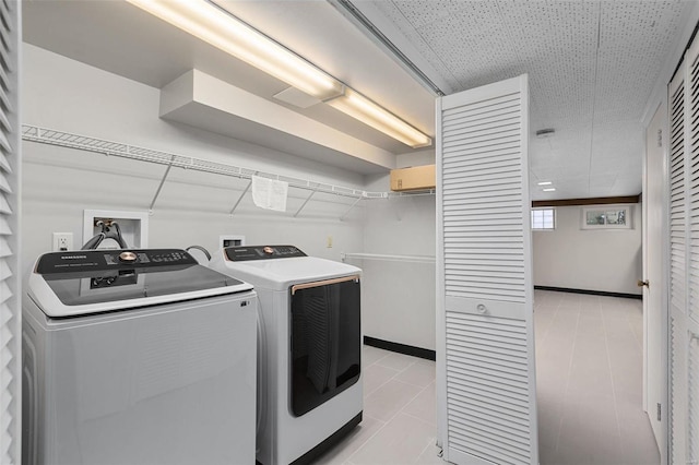 clothes washing area featuring washing machine and dryer