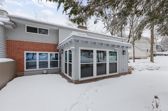 view of snow covered house