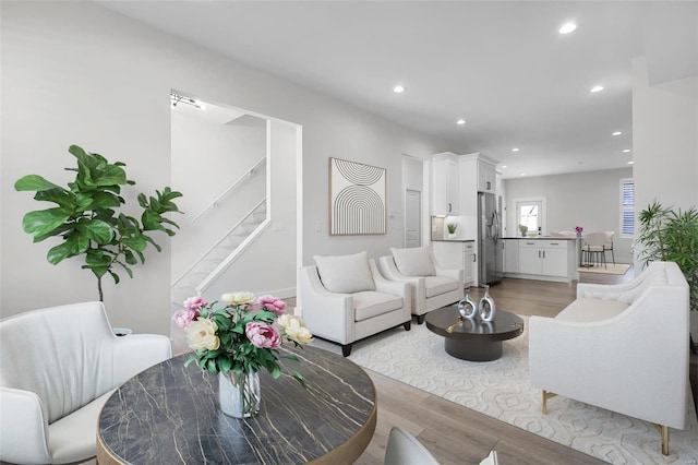 living room with light hardwood / wood-style flooring