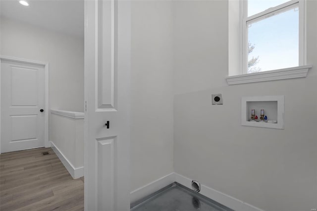 laundry room featuring washer hookup, light wood-type flooring, and hookup for an electric dryer