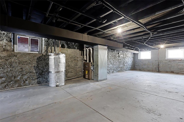 basement with heating unit and water heater