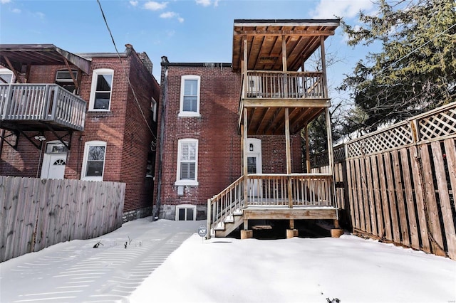 view of snow covered house