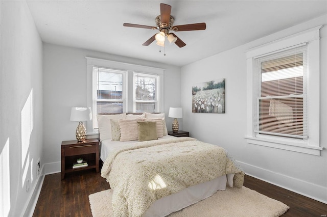 bedroom with ceiling fan and dark hardwood / wood-style floors