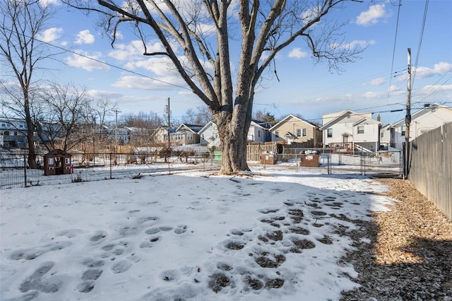 view of yard layered in snow