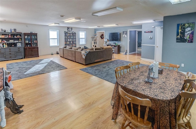 dining area with light hardwood / wood-style flooring