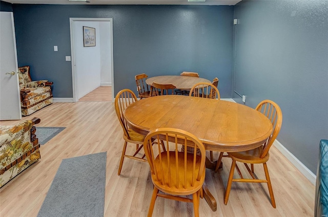 dining room with light hardwood / wood-style flooring