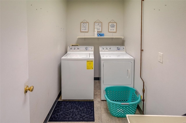 laundry room featuring separate washer and dryer