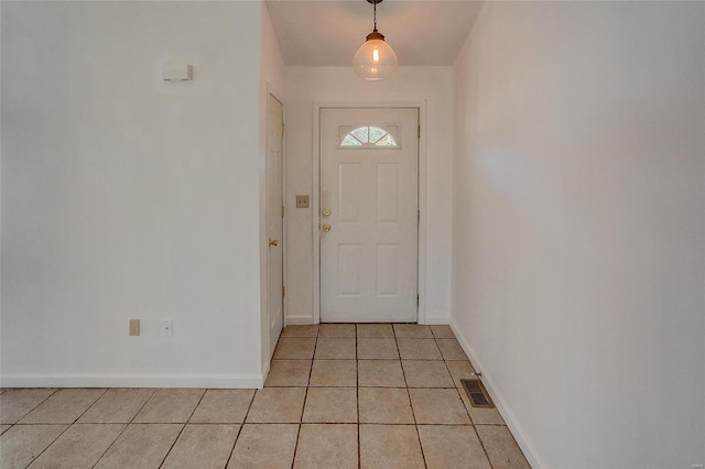 entryway with light tile patterned floors