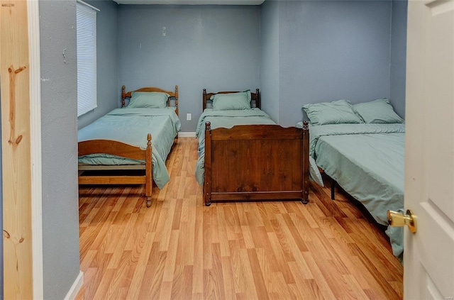 bedroom with light wood-style floors