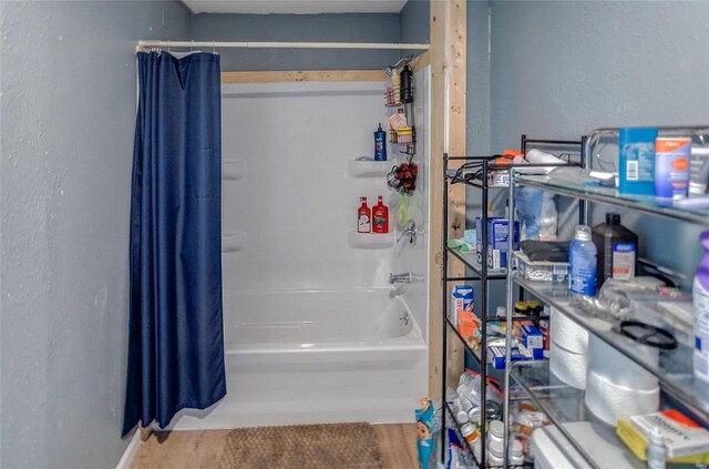 bathroom with shower / bathtub combination with curtain