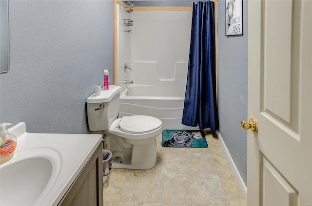 full bathroom with baseboards, a textured wall, toilet, shower / bath combo with shower curtain, and vanity