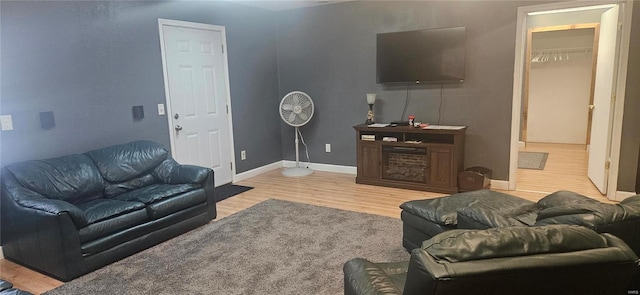 living room with wood finished floors and baseboards