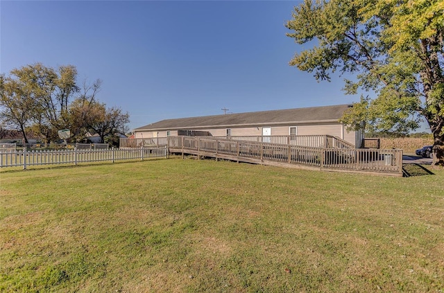 view of yard featuring a deck and fence