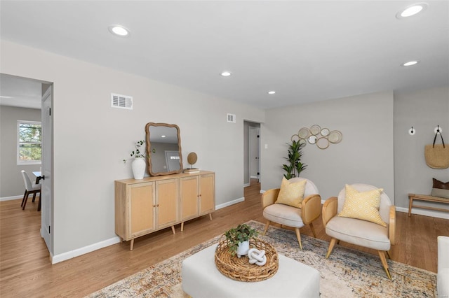 sitting room featuring light hardwood / wood-style flooring