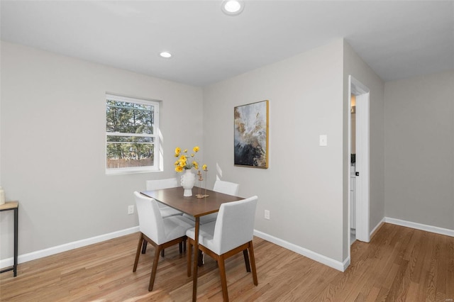 dining area with light hardwood / wood-style floors