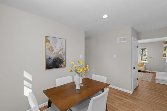 dining space featuring light hardwood / wood-style floors