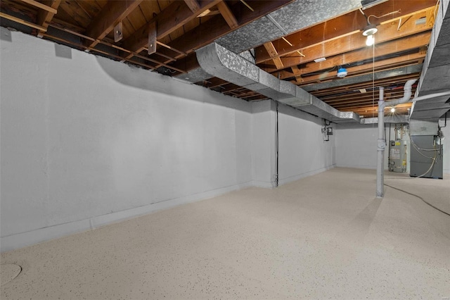 basement featuring heating unit and water heater