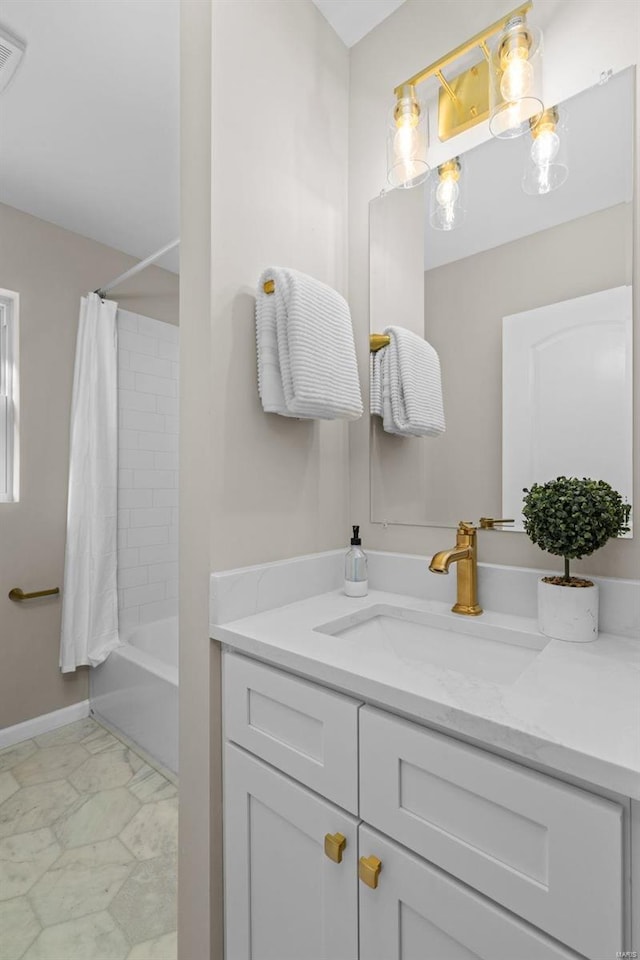 bathroom with shower / tub combo and vanity