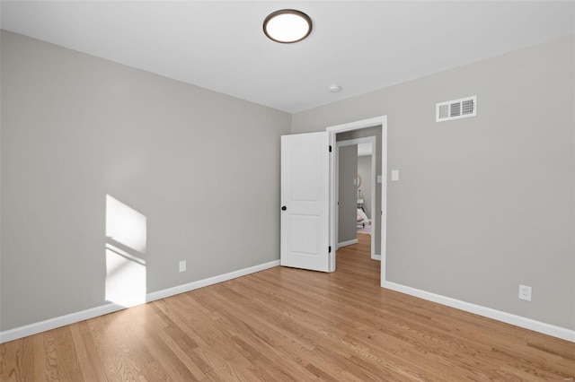 spare room featuring light hardwood / wood-style flooring