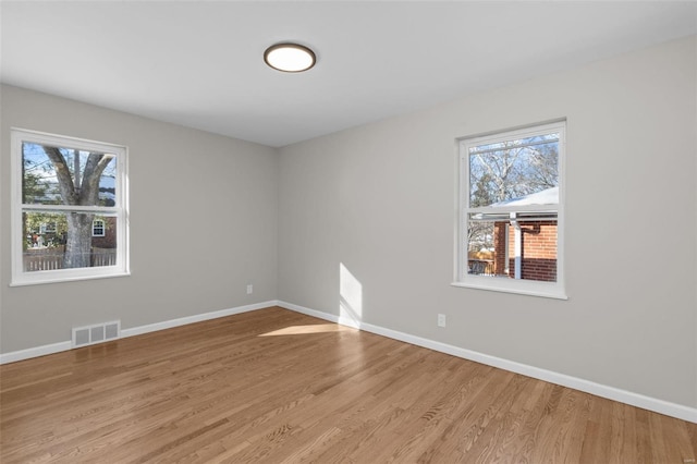 unfurnished room featuring light wood-type flooring