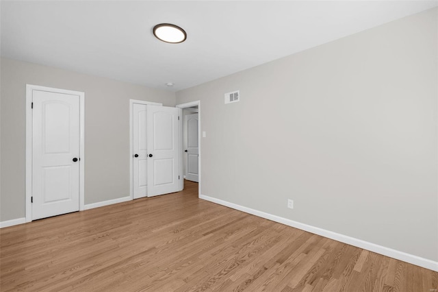 unfurnished bedroom with light hardwood / wood-style flooring