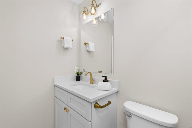 bathroom with toilet and vanity