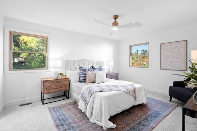 carpeted bedroom with ceiling fan