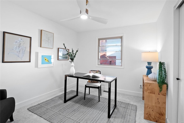 office featuring light carpet and ceiling fan