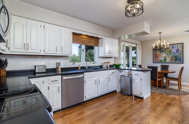 kitchen featuring white cabinetry, dishwasher, light wood-type flooring, and sink