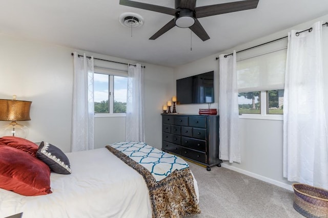 carpeted bedroom with ceiling fan