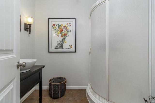 bathroom featuring tile patterned floors, vanity, and an enclosed shower