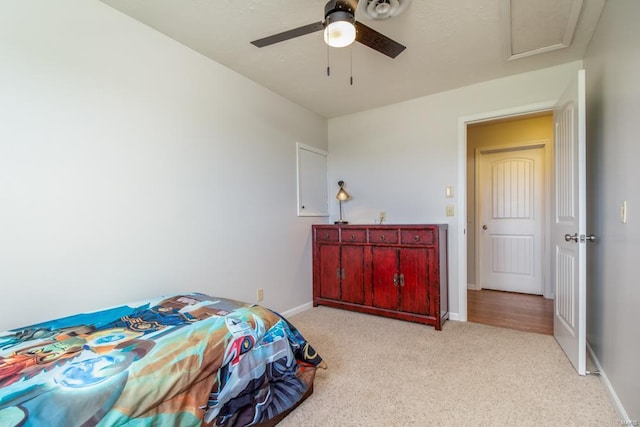 bedroom with ceiling fan and light carpet