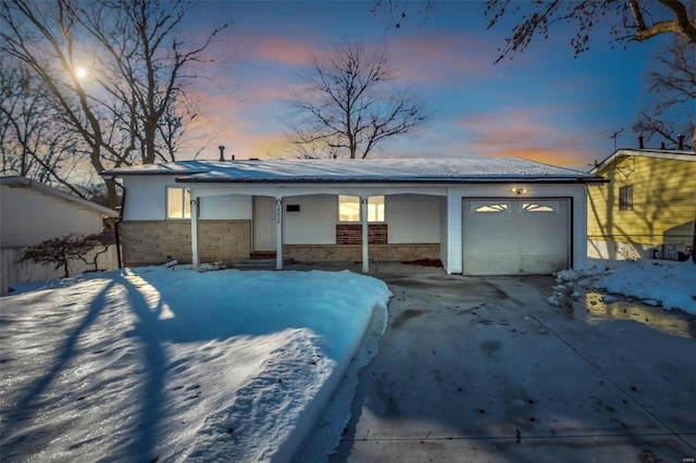 ranch-style house featuring a garage