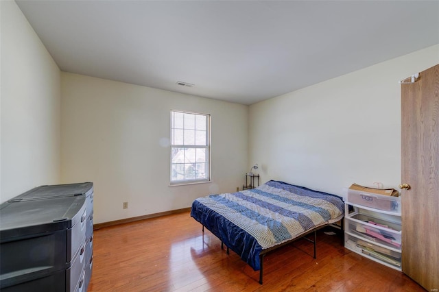 bedroom featuring light wood-type flooring