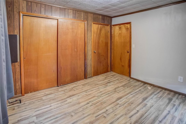 unfurnished bedroom featuring a closet and wood finished floors