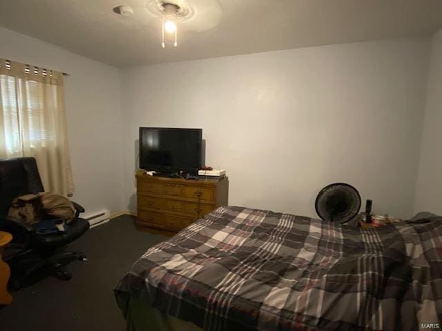 bedroom featuring carpet flooring, a baseboard heating unit, and ceiling fan