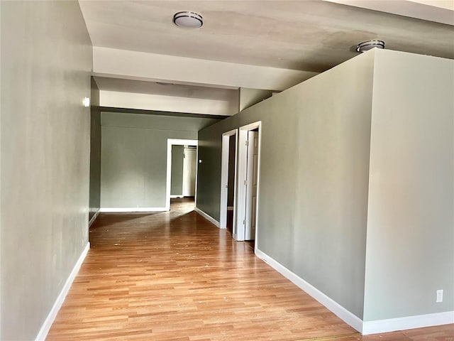 hallway with light hardwood / wood-style flooring