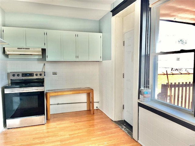 kitchen with light wood-type flooring and stainless steel electric range