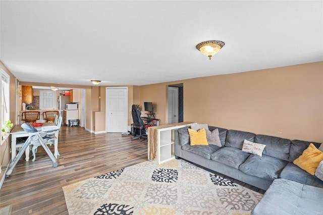 living room with dark hardwood / wood-style flooring